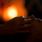 persons hand on top of sun